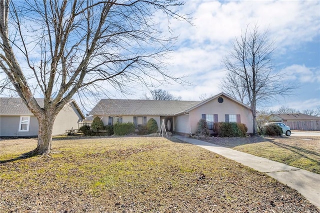 ranch-style home with a front yard