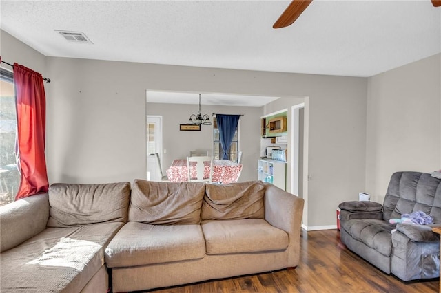 living room featuring hardwood / wood-style flooring and ceiling fan