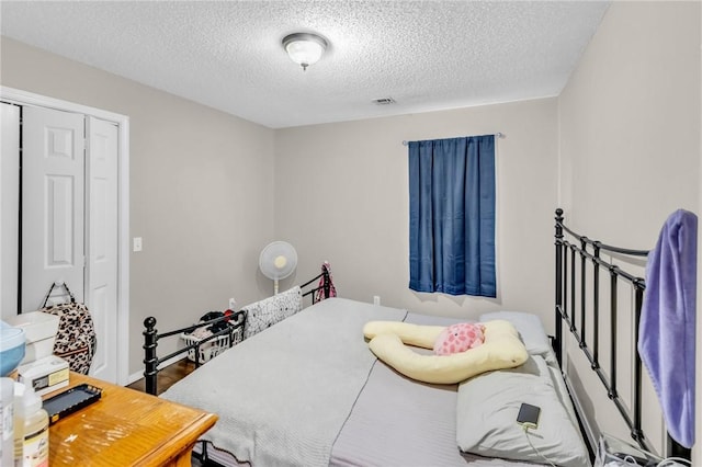 bedroom with a textured ceiling