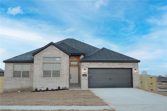 view of front of property with a garage