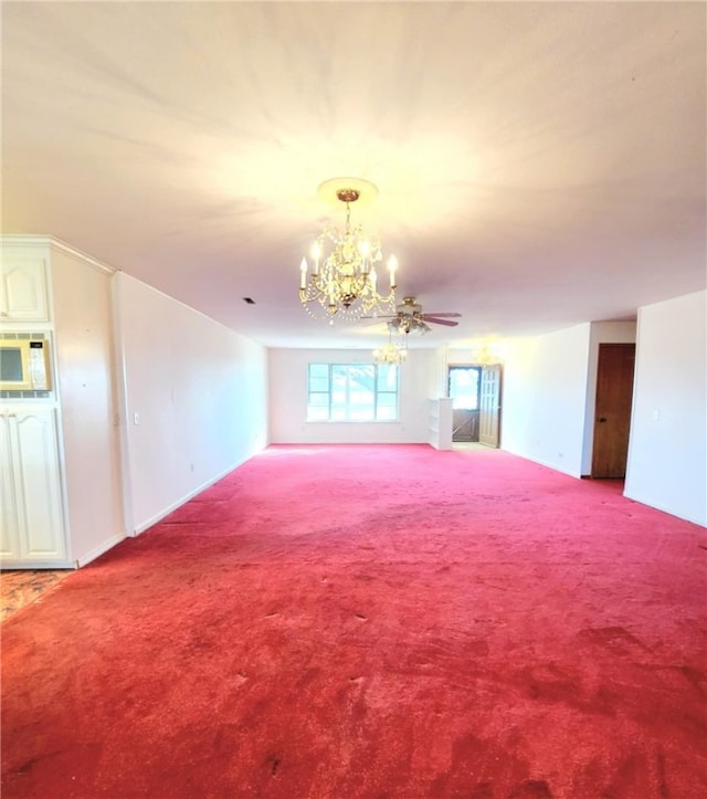 unfurnished living room featuring an inviting chandelier and carpet