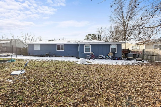 back of property with a trampoline