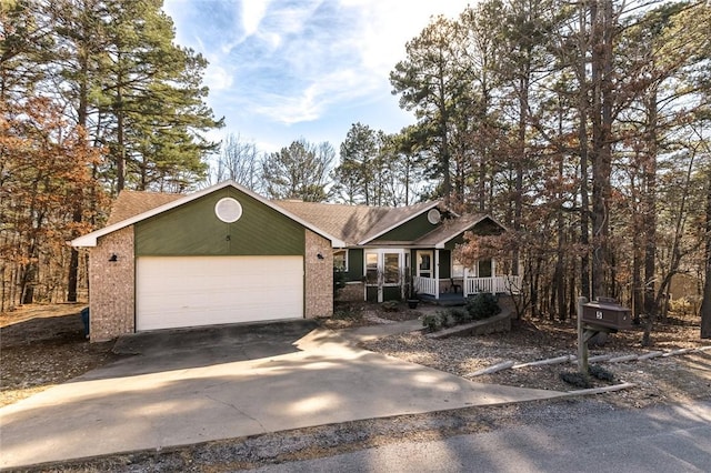 view of front of property with a garage and a porch