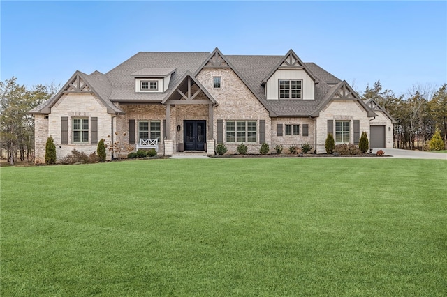 view of front of house with a front lawn, concrete driveway, and roof with shingles