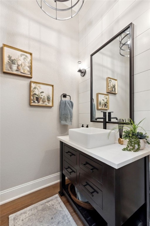 bathroom with vanity and wood-type flooring