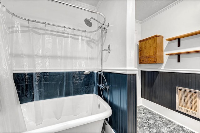 bathroom with ornamental molding, heating unit, and shower / tub combo with curtain