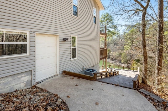 view of home's exterior with a wooden deck and central air condition unit