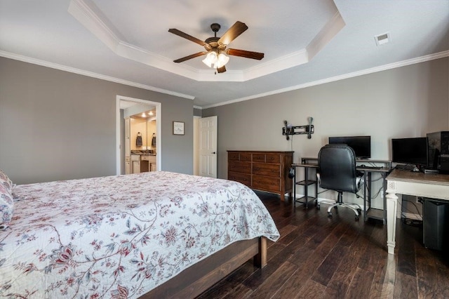 bedroom with ornamental molding, ceiling fan, dark hardwood / wood-style flooring, and a tray ceiling