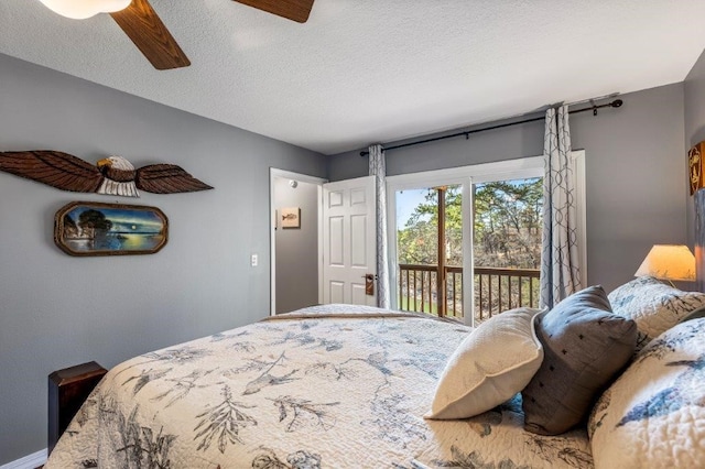 bedroom with ceiling fan, access to outside, and a textured ceiling