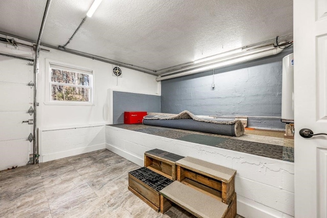 mudroom featuring a textured ceiling