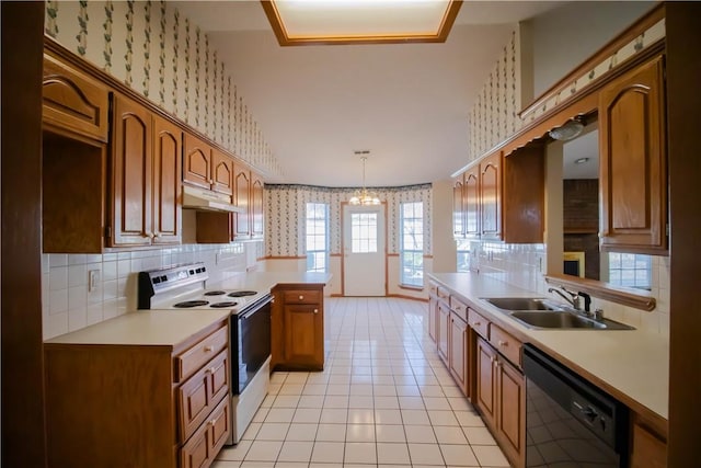 kitchen featuring dishwasher, sink, hanging light fixtures, light tile patterned floors, and white range with electric cooktop