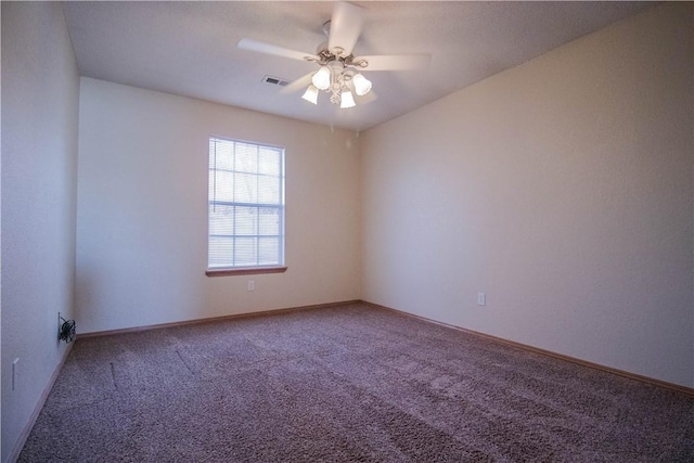 spare room with ceiling fan and carpet floors