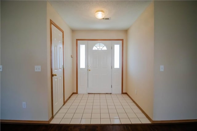 entrance foyer with light tile patterned floors