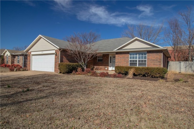 ranch-style home with a garage and a front yard