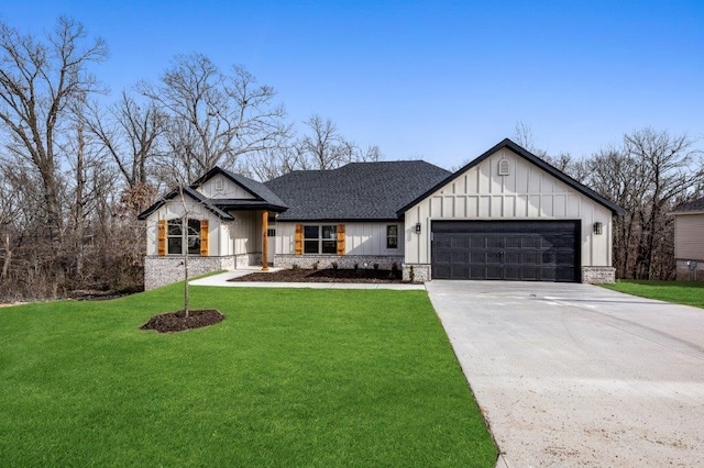 modern farmhouse featuring roof with shingles, board and batten siding, a front yard, a garage, and driveway