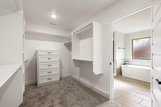 walk in closet featuring visible vents