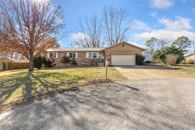 ranch-style home with a garage and a front lawn