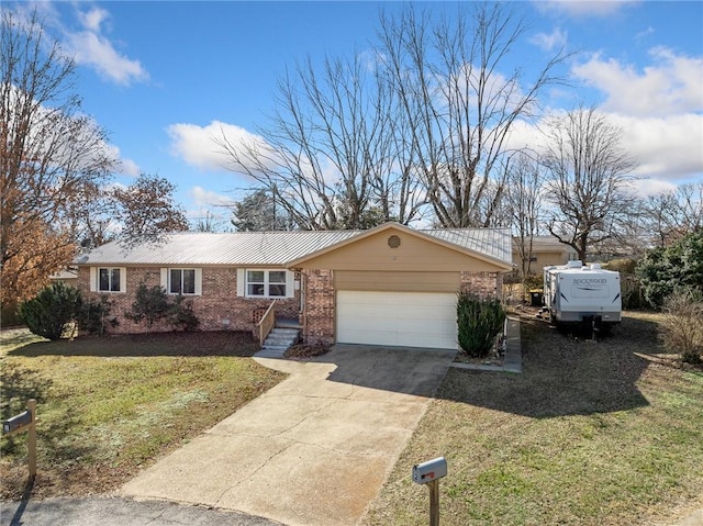 single story home featuring a garage and a front lawn