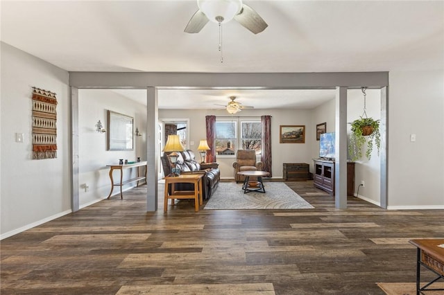 living room featuring dark hardwood / wood-style flooring and ceiling fan