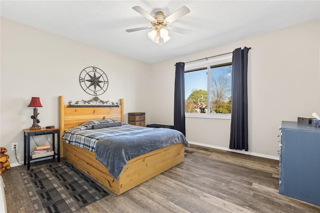 bedroom with dark wood-type flooring and ceiling fan