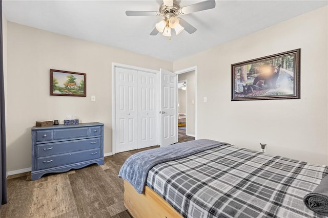 bedroom with ceiling fan, dark hardwood / wood-style flooring, and a closet