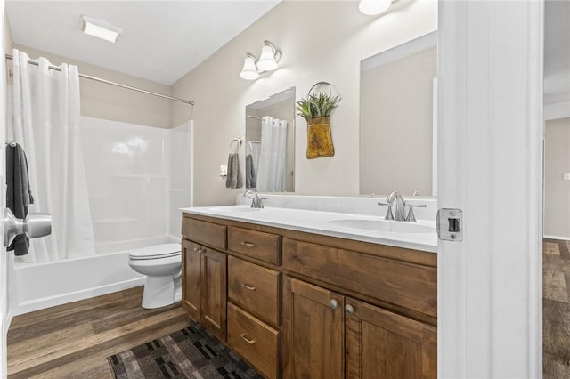 full bathroom with shower / bath combination with curtain, wood-type flooring, toilet, and vanity