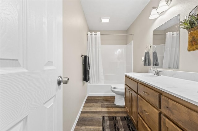 full bathroom featuring wood-type flooring, toilet, shower / tub combo, and vanity