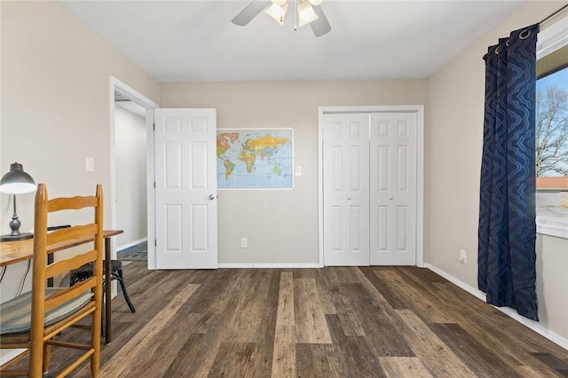 bedroom with ceiling fan, dark hardwood / wood-style floors, and a closet