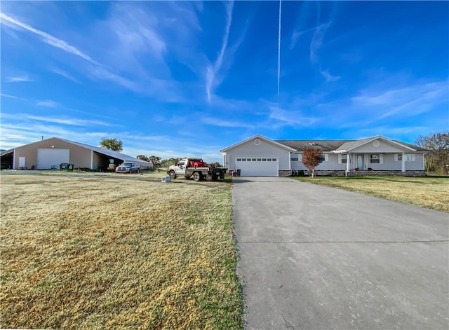 view of front of property featuring a garage and a front lawn