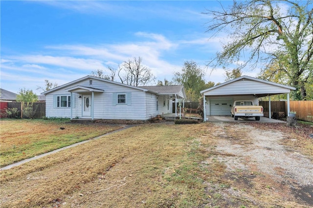 ranch-style home with a carport and a front yard