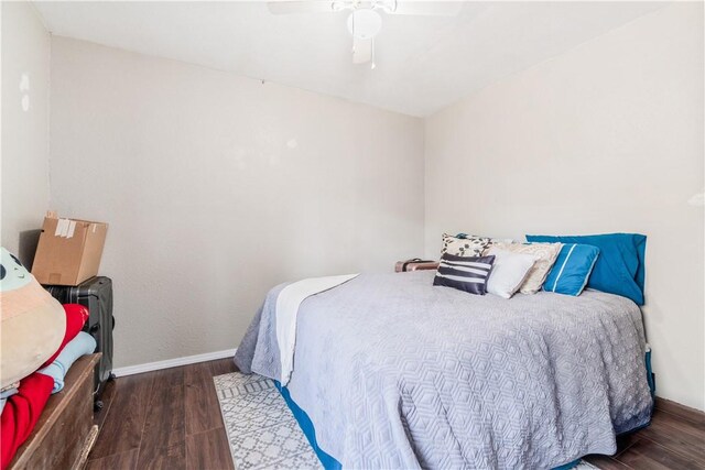 bedroom featuring ceiling fan and dark hardwood / wood-style floors