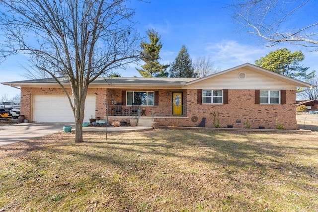 single story home with a garage, a front yard, and covered porch