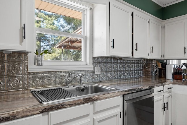 kitchen with white cabinetry, dishwasher, sink, and tasteful backsplash