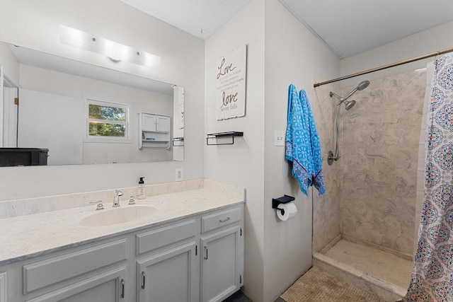 bathroom featuring vanity and a shower with shower curtain