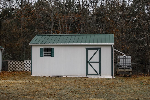 view of outbuilding with a lawn