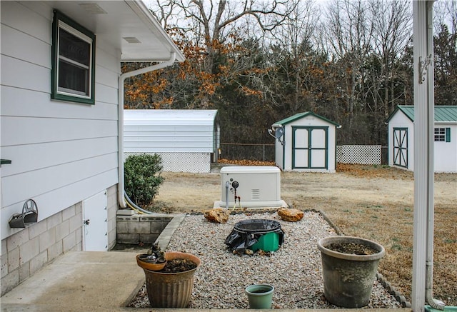 view of yard featuring a shed and a fire pit