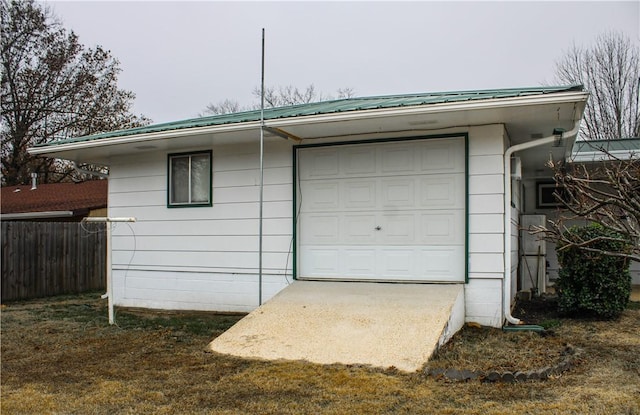 garage featuring a lawn