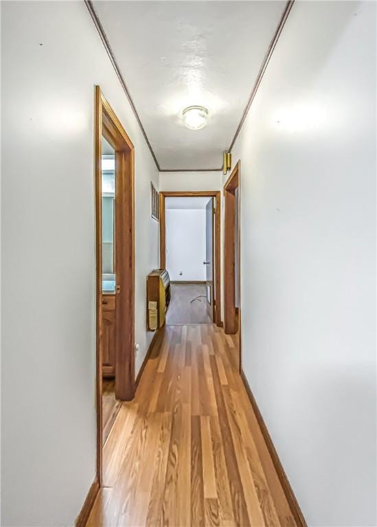 hall with light hardwood / wood-style flooring