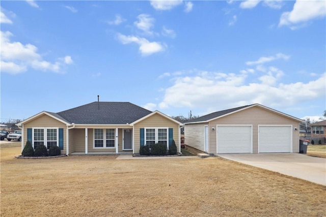 ranch-style house with a garage and a front lawn