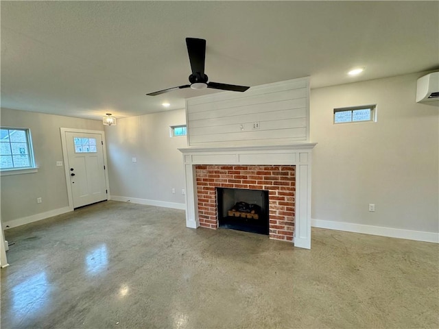 unfurnished living room featuring ceiling fan, plenty of natural light, and a wall mounted AC