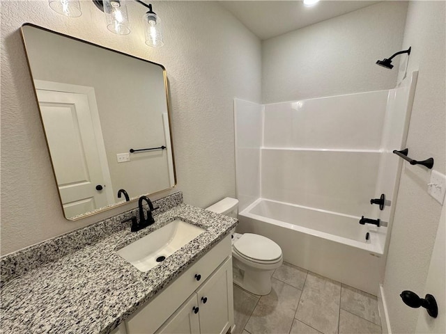 full bathroom featuring tile patterned flooring, vanity, tub / shower combination, and toilet