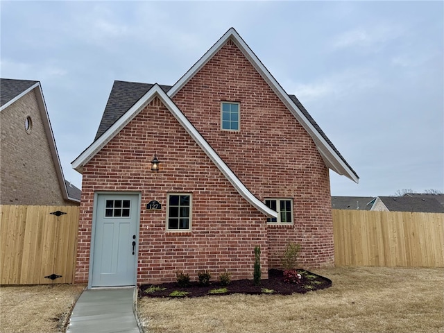 back of property featuring a lawn