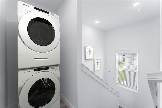 laundry room featuring stacked washing maching and dryer