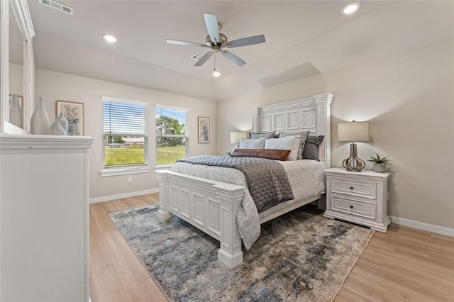 bedroom with ceiling fan and light hardwood / wood-style floors