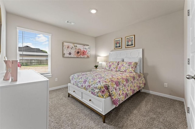 bedroom featuring light carpet