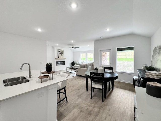 1623 Ridgeview Dr, Springdale, AR 72762 - living room featuring ceiling fan, light wood-type flooring, recessed lighting, vaulted ceiling, and baseboards