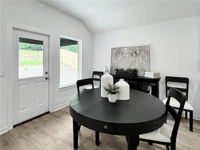 1623 Ridgeview Dr, Springdale, AR 72762 - dining space with lofted ceiling, light wood-style flooring, and baseboards