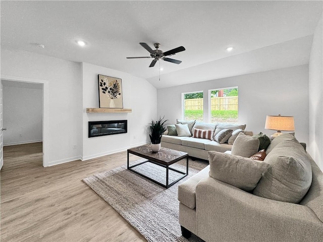 1623 Ridgeview Dr, Springdale, AR 72762 - living area featuring ceiling fan, a glass covered fireplace, wood finished floors, baseboards, and recessed lighting