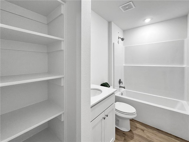 1623 Ridgeview Dr, Springdale, AR 72762 - full bathroom with wood finished floors, toilet, shower / washtub combination, and vanity