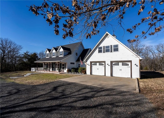 view of front facade featuring a garage and covered porch